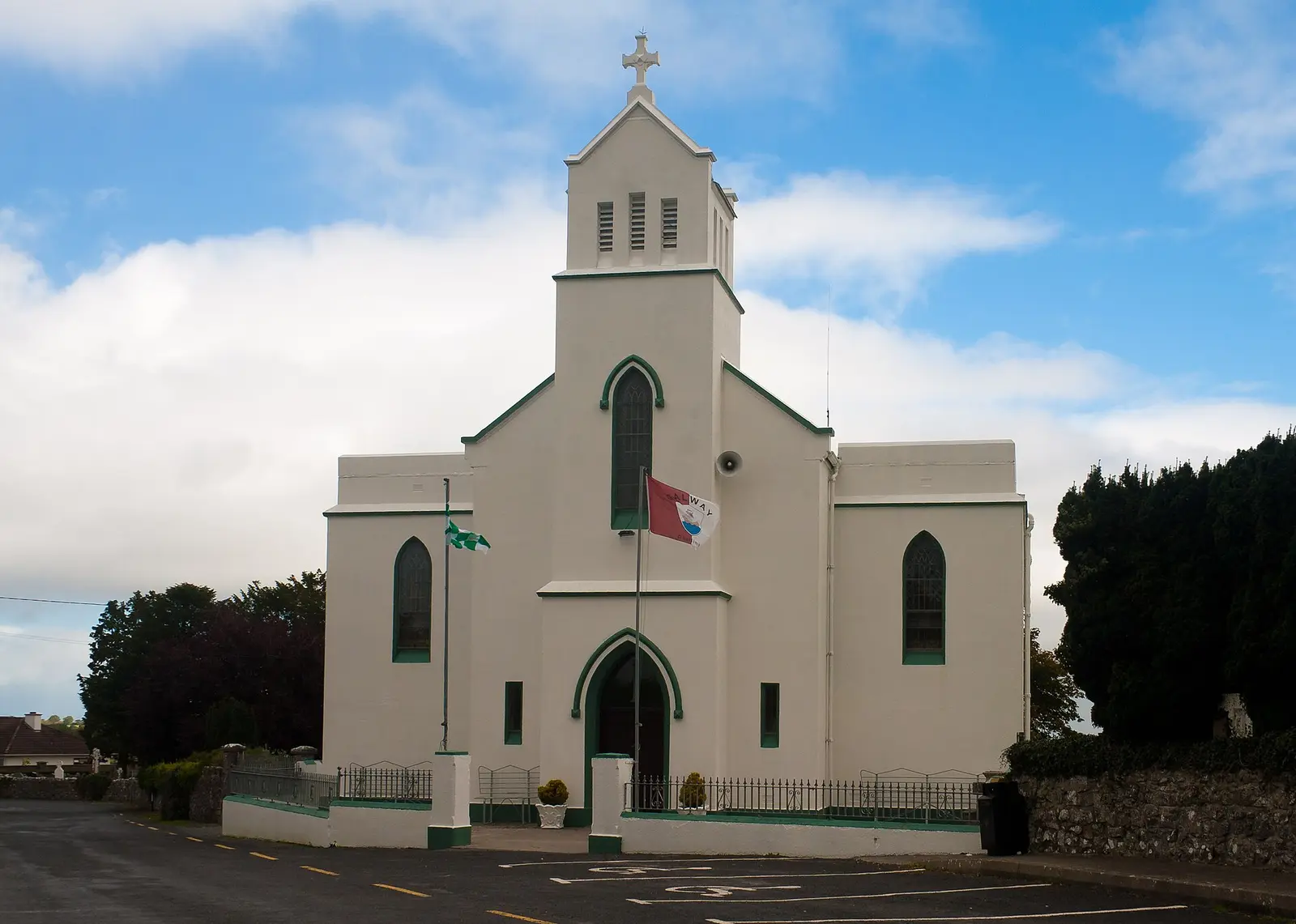 Tower and west façade of Our Lady of Lourdes Church in Caltra.