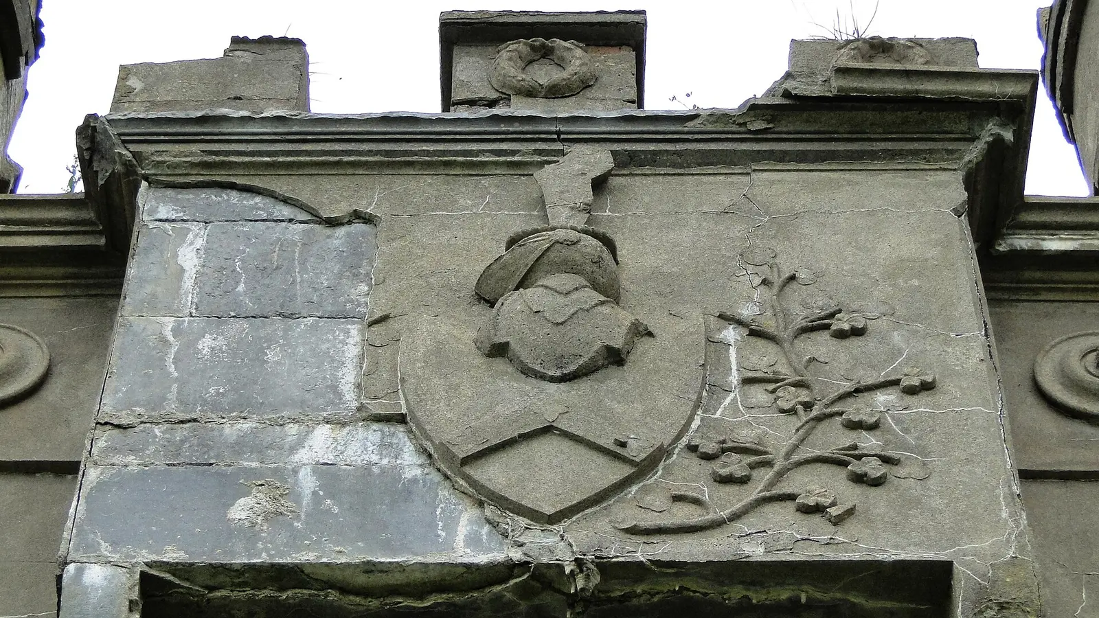 Architectural detail of the ruined Clifden Castle, County Galway, Ireland. Arms of Eyre of Eyre Court…
