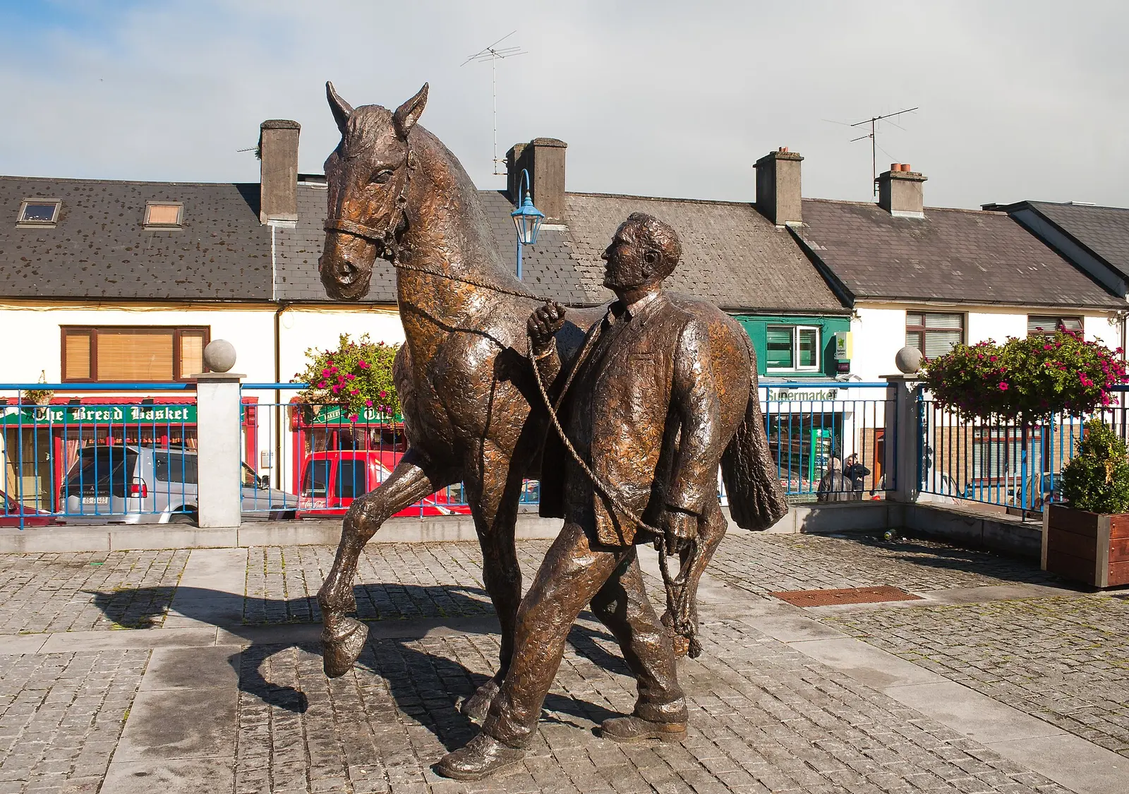 Bronze sculpture Horse and Handler in reference to the Ballinasloe Horse Fair by the sculptor James McCarthy, erected at St Michael's Square in May 2003.