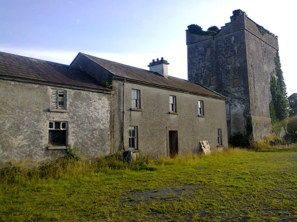 Monivea Castle from the north east. The building to the right is the original Anglo-Norman tower house, while the main part of the later mansion, which was loca